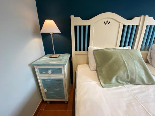 Ένα ή περισσότερα κρεβάτια σε δωμάτιο στο Hostal Casa San Nicolas