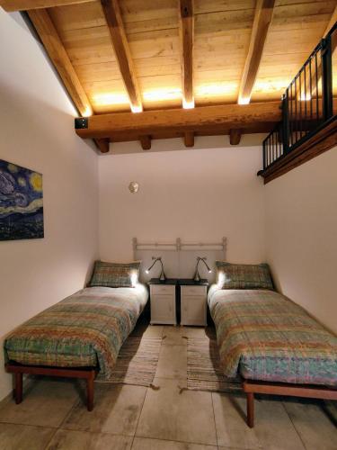 Postel nebo postele na pokoji v ubytování B&B Al Vecchio Torchio