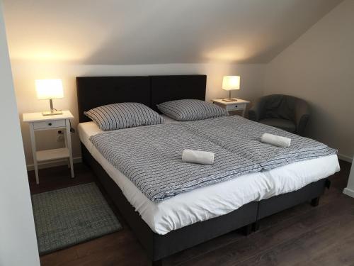 a bedroom with a bed with two pillows on it at Adri Apartman in Zalakaros
