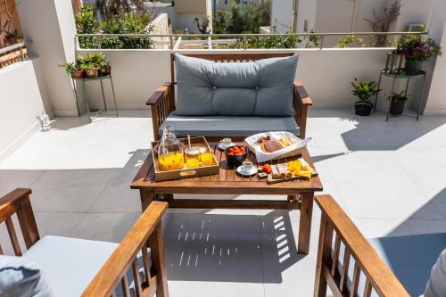 a tray of food on a table on a balcony at Villa Oliveto in Tavronitis