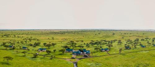 an aerial view of a house in a field at Serengeti Sametu Camp in Serengeti National Park