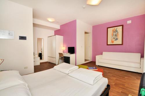 Postel nebo postele na pokoji v ubytování Hotel Nederland