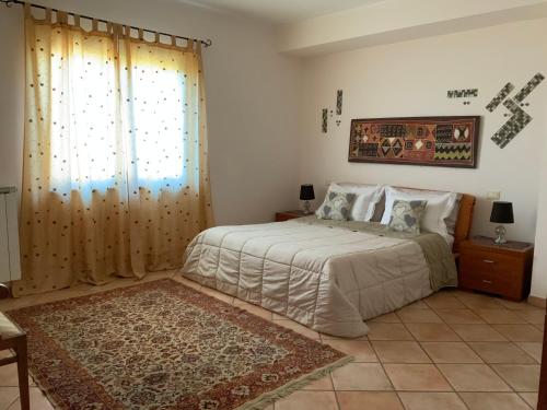 Villa Isotta tesisinde bir odada yatak veya yataklar