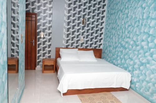 Un pat sau paturi într-o cameră la ODG Cotonou - Résidences Océan De Grâce
