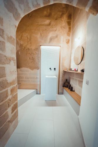 a room with a white door with a face drawn on it at Endea Suite Rooms & Lounge SPA in Matera