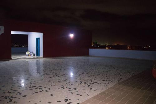 a dark room with a floor with birds on it at ODG Cotonou - Résidences Océan De Grâce in Cotonou