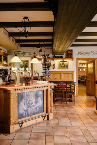 a kitchen with a table and a dining room at Zum Fally - Landgasthof in Kirchberg am Wechsel
