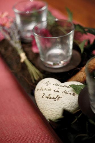 a heart shaped object on a table with glasses at Hotel Landgasthof Wallburg in Eltmann