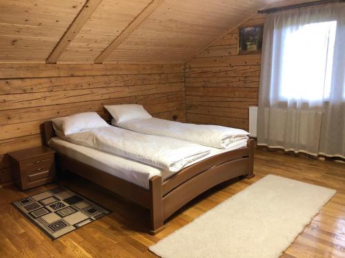 Postel nebo postele na pokoji v ubytování Вербовий двір - Willow Yard