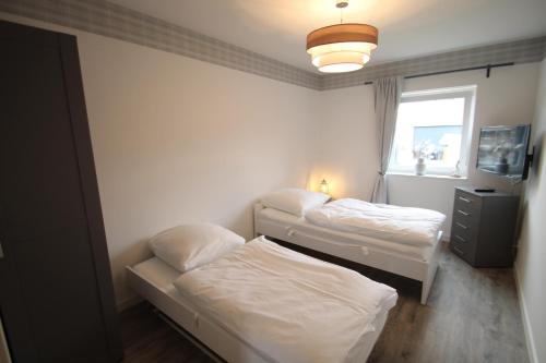 Postel nebo postele na pokoji v ubytování 2204 - Knerten