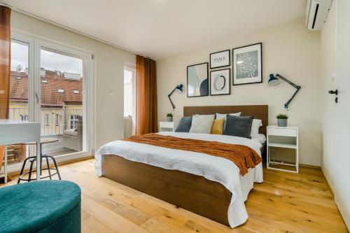 A bed or beds in a room at Premium Hip Loft in Žižkov by Prague Days