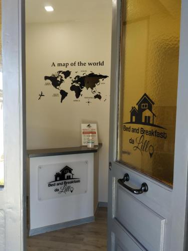 a map of the world stenciled on a door at B&B via Piave da Lillo in Frosinone