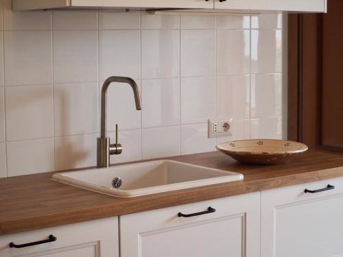 a kitchen with a sink and a bowl on a counter at Casa Ulisse in Roccella Ionica