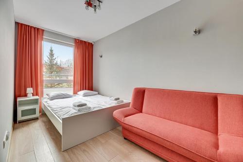 Postel nebo postele na pokoji v ubytování Dom & House - Apartamenty Sunrise