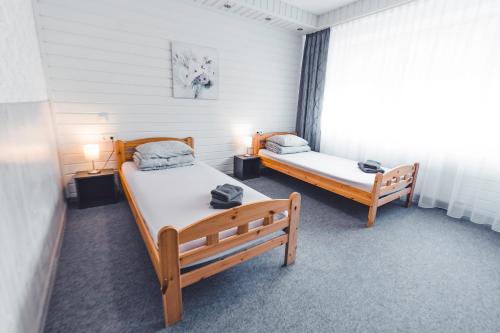 Кровать или кровати в номере O.K. Hotel