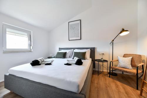 Katil atau katil-katil dalam bilik di Modern holiday apartment "Libra" with swimming pool