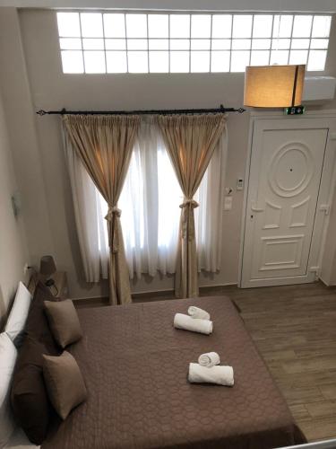 Postel nebo postele na pokoji v ubytování VASILEVI STUDIOS