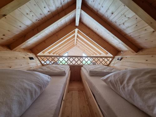 Un ou plusieurs lits dans un hébergement de l'établissement Chalet met Sauna en Airconditioning