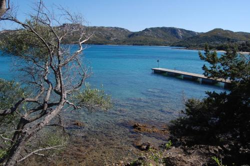 a dock in the middle of a large body of water at Le Ville Le Saline in Palau