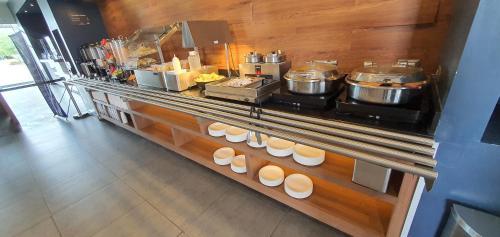 a counter in a kitchen with pots and pans at Microtel Inn & Suites by Wyndham San Luis Potosi in San Luis Potosí