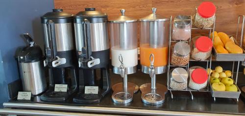 a group of appliances sitting on top of a counter at Microtel Inn & Suites by Wyndham San Luis Potosi in San Luis Potosí