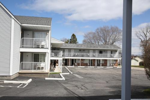a large white building with a parking lot at Aurora Borealis in Saint Ignace