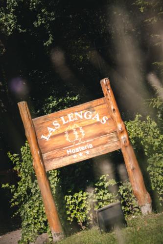 a sign that says us living aids in honduras at Hosteria Las Lengas by Visionnaire in San Martín de los Andes
