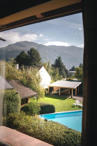 a view of a yard with a swimming pool at Hosteria Las Lengas by Visionnaire in San Martín de los Andes