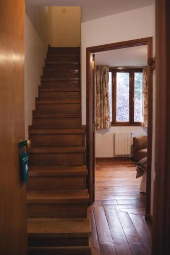 a stairway in a house with a stair case at Hosteria Las Lengas by Visionnaire in San Martín de los Andes
