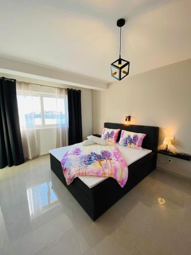a bedroom with a large bed in a room at Apartment Mare in Rab