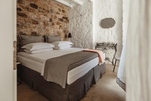 Postel nebo postele na pokoji v ubytování Ayiopetra Exclusive Getaways