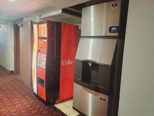 a couple of coke machines sitting next to each other at Blackstone Lodge and Suites in Lead