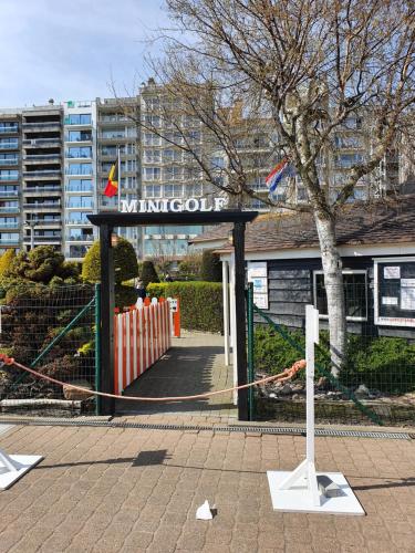 a entrance to a building with a sign on it at SWEET HOME in Blankenberge