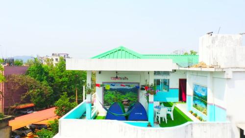 a house with a painting on the side of it at Cupidtrails Backpacker's Penthouse in Guwahati
