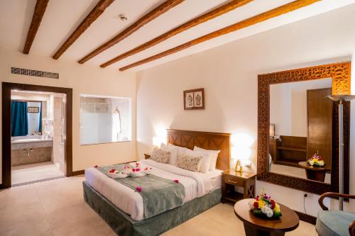Ένα ή περισσότερα κρεβάτια σε δωμάτιο στο Club Reef Resort & Spa