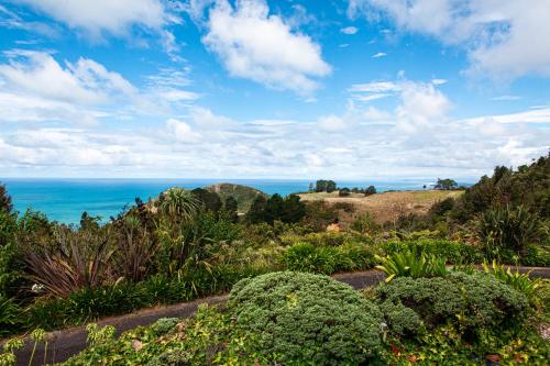 a view of the ocean from the garden at Orokawa Bay Retreat in Waihi