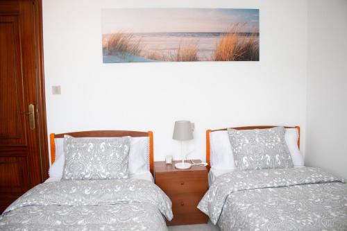 A bed or beds in a room at Apartamento Sol-Muxía