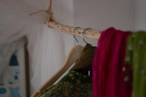 a wooden rod with a curtain hanging on a wall at El Carmen in Ribera Alta