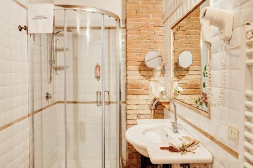 a bathroom with a sink and a shower at Castello di Spedaletto da Laura in Pienza