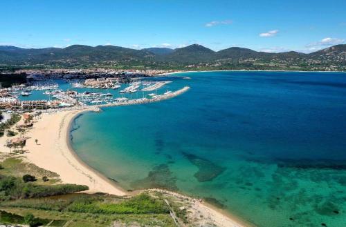 an aerial view of a beach and the ocean at Appartement climatisé refait à neuf - VUE MER Saint-Tropez - Piscine- 50m plage in Gassin