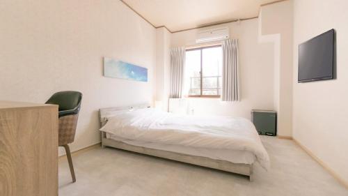 VOYAN Resort Fujiyamanakako Gekkoso tesisinde bir odada yatak veya yataklar