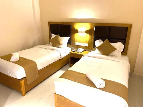 Postel nebo postele na pokoji v ubytování TAG HOTELS