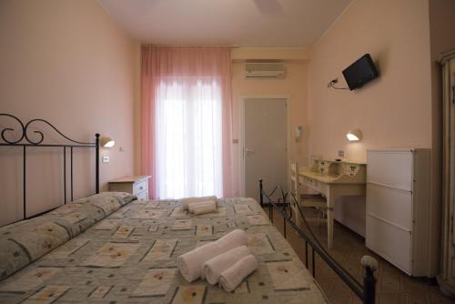 Hotel Settebello B&Bにあるベッド