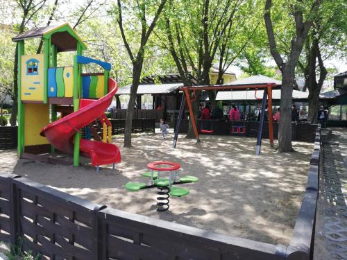 a park with a playground with a slide at Hotel Ponti in Vidin