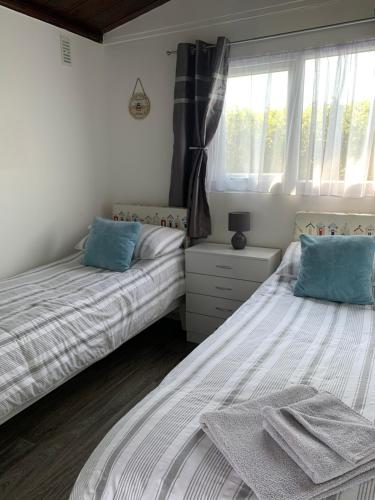 Postel nebo postele na pokoji v ubytování Chalet 26