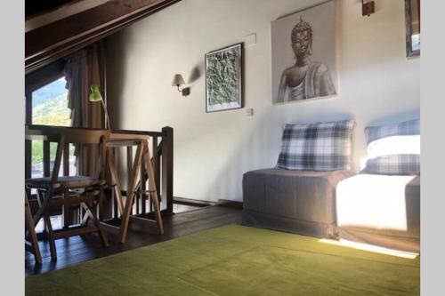 a bedroom with a bed and a desk and a chair at Espectacular ático duplex en Isil in Isil