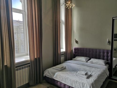Postel nebo postele na pokoji v ubytování Opera Apart Hotel