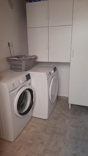 a washing machine and a washer in a kitchen at Apartment Lavanda in Sinj