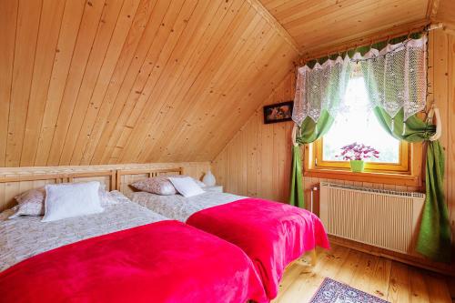 Postel nebo postele na pokoji v ubytování Kurpiowska Chatka