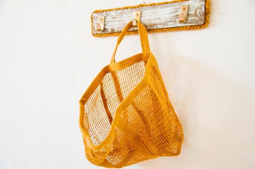 a yellow net hanging on a wall at Turquesa Beach&Pool Apartaments in Playa Honda